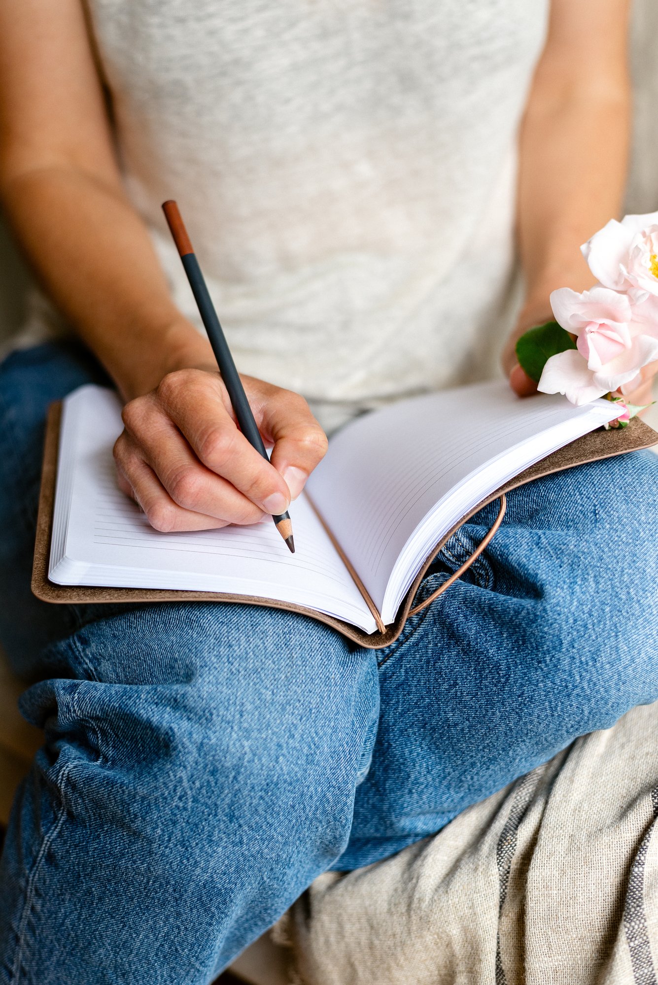 woman-makes-notes-in-a-notepad-2025-01-09-06-49-21-utc-1